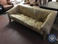 A 1970's wooden framed leather three seater settee
