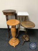 An antique inlaid plant stand together with a gilt and marble two tier plant stand and two others