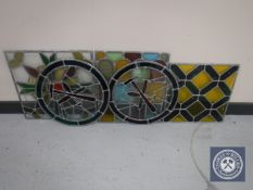 Five unframed coloured stained glass panels