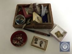 A carved Eastern box of costume jewellery, cuff links, tie pins, nail care kit, fountain pen,