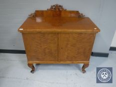 A continental walnut double door cabinet