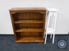 A set of pine open bookshelves together with a painted two tier plant stand