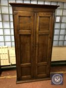 A 19th century oak double door hall cabinet