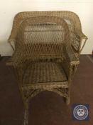 A wicker two seater settee and armchair