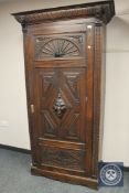 A 19th century carved oak single door cabinet,