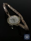 A lady's 9ct gold wristwatch on 9ct gold expanding bracelet, 16.