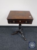 An early 19th century mahogany pedestal occasional sewing table fitted with a drawer