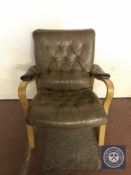 A twentieth century beech framed armchair