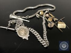 A silver Albert chain with T-bar and token,