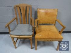 A pine armchair together with a buttoned leather armchair
