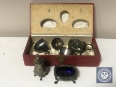 A three piece sterling silver cruet set, two spoons,