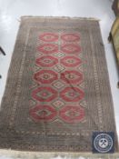A Persian style fringed rug