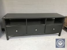 An Ikea entertainment stand fitted with three drawers