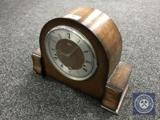 An oak cased Smiths Enfield mantel clock with pendulum and key