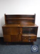 A mid twentieth century teak sideboard