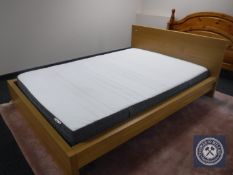 An Ikea 4'6 bed frame with mattress