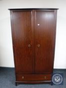 A Stag Minstrel double wardrobe fitted a drawer