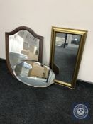 An inlaid mahogany shield-shape mirror together with a frameless bevelled edge mirror and a gilt