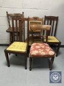 A pair of oak rail back chairs together with two antique mahogany chairs and an oak bar stool