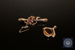 A 9ct gold tiger's eye and onyx pendant together with a Victorian seed pearl bar brooch