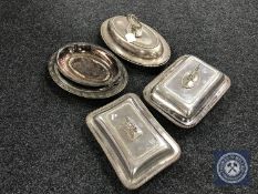 Four plated entree dishes with covers