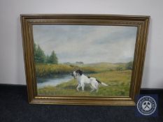 A gilt framed oil on canvas of a gun dog,