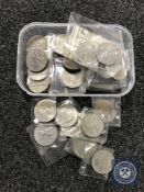 A tub containing a collection of crowns