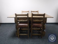 A 20th century oak refectory dining table together with four chairs