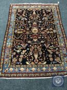 An antique Persian Feraghan rug,