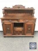 A Victorian carved oak Green Man sideboard,