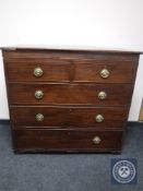 An early Victorian inlaid mahogany five drawer chest