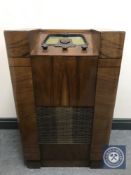 An early 20th century radio with Bakelite dial in a walnut case.