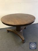 A Victorian mahogany tilt top dining table