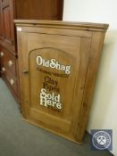 A 19th century pine corner cupboard bearing 