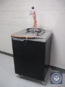 A beer dispenser with cooling cabinet