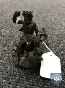 A small bronze figure of King Neptune, lacking trident, height 7.