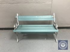 A wrought iron and wood garden bench