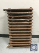 An antique fourteen bar cast iron radiator