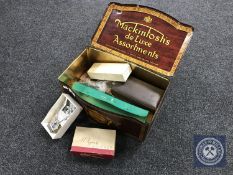 A vintage Mackintosh's Deluxe Assortment's biscuit tin containing recorder, Hohner Melodica Soprano,