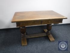 An early 20th century oak refectory table fitted two drawers CONDITION REPORT:
