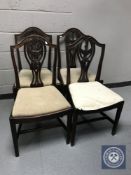 A set of four mahogany Hepplewhite style dining chairs
