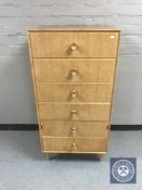 A mid twentieth century teak six drawer chest