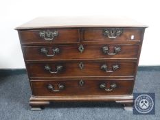 A George III mahogany five drawer chest with brass drop handles on bracket feet