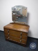 An oak dressing chest fitted three drawers