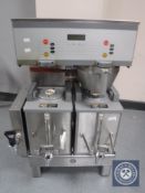 A stainless steel commercial coffee machine