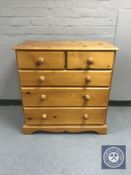 A pine five drawer chest