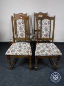 A set of four oak Old Charm tapestry upholstered dining chairs