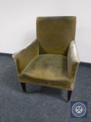 An Edwardian Regency style library armchair upholstered in green dralon