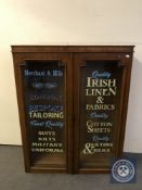 A Victorian glazed door bookcase bearing Haberdashery advertising