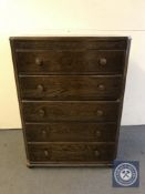 A mid 20th century oak five drawer chest